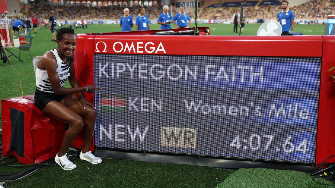 Faith Kipyegon celebrates after setting a new world record at four minutes, 7.64 seconds.