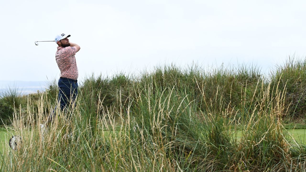 England's Tyrrell Hatton plays the 13th hole.