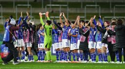 Japan's players line up and acknowledge the crowd following their 5-0 win.