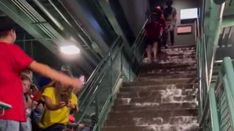Watch baseball fans navigate a flooded Fenway Park | CNN