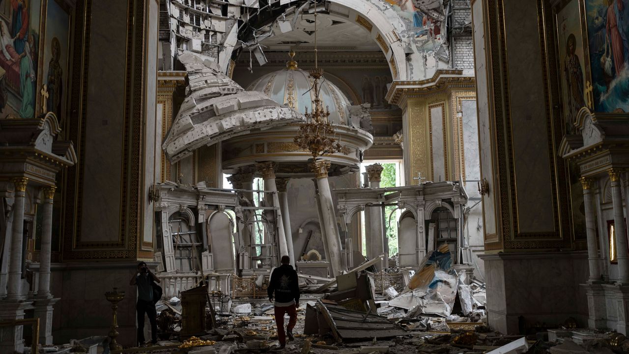 Church personnel inspect damages inside the Odesa Transfiguration Cathedral. 