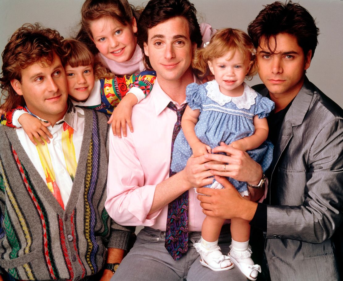 (From left) Dave Coulier, Jodie Sweetin, Candace Cameron Bure, Bob Saget, Mary-Kate/Ashley Olson and John Stamos in 'Full House.' 