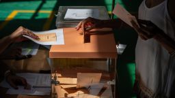 MADRID, SPAIN - 2023/07/23: A woman casts her vote at a polling station during the general elections day. Spanish citizens are called to the polls to vote and elect the next government of Spain. (Photo by Marcos del Mazo/LightRocket via Getty Images)