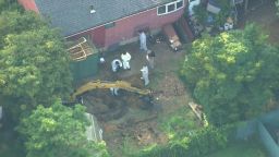 Investigators search the backyard of Rex Heuermann's home in Massapequa Park, New Jersey, on Sunday, July 23, 2023.