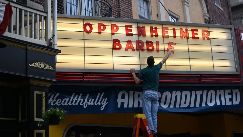 NextImg:Blockbuster 'Barbenheimer' debut sparks hopes that cinema is back | CNN Business