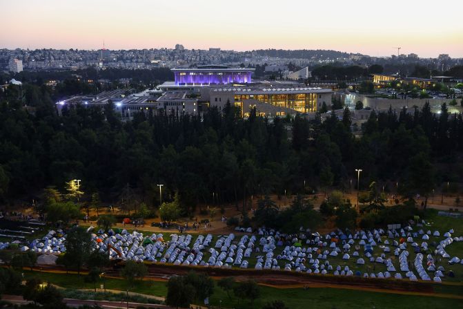 Protesters gather in a camp they set up near the Knesset building on Sunday, July 23.