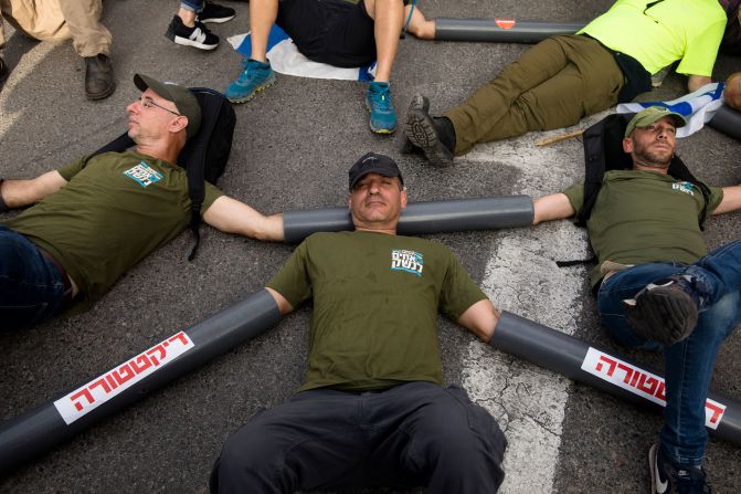 Protesters block the main entrance to the Ministry of Defense during a protest in Tel Aviv on July 18.