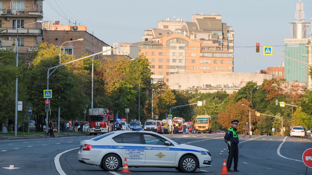 A police officer blocks a road following a reported drone attack in central Moscow on July 24, 2023.
