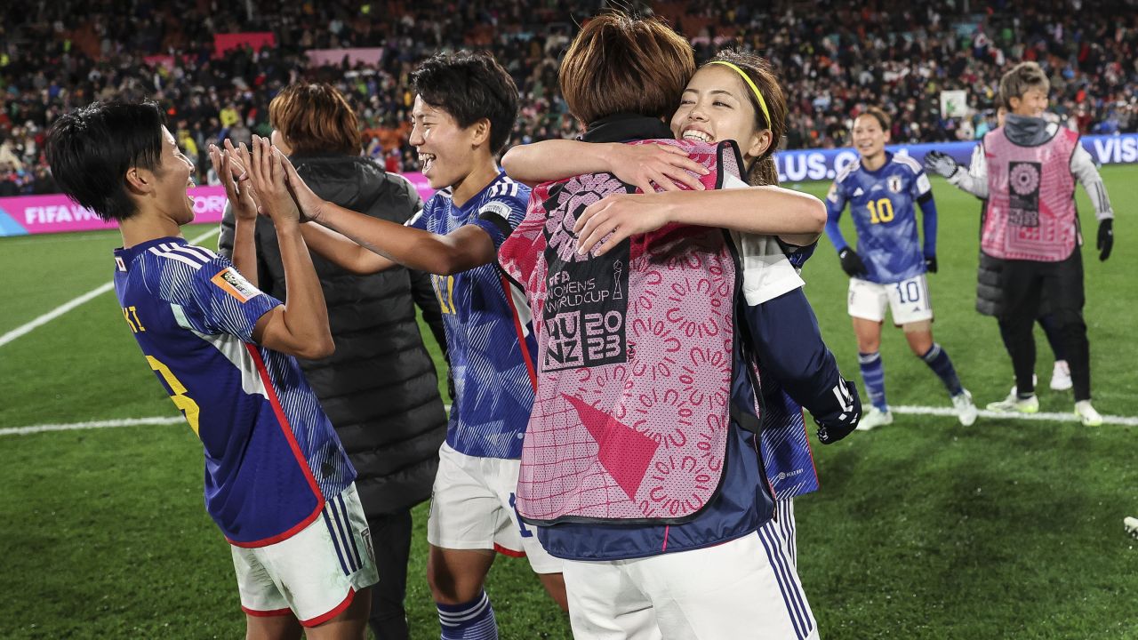 Japan players celebrate the team's 5-0 victory against Zambia.