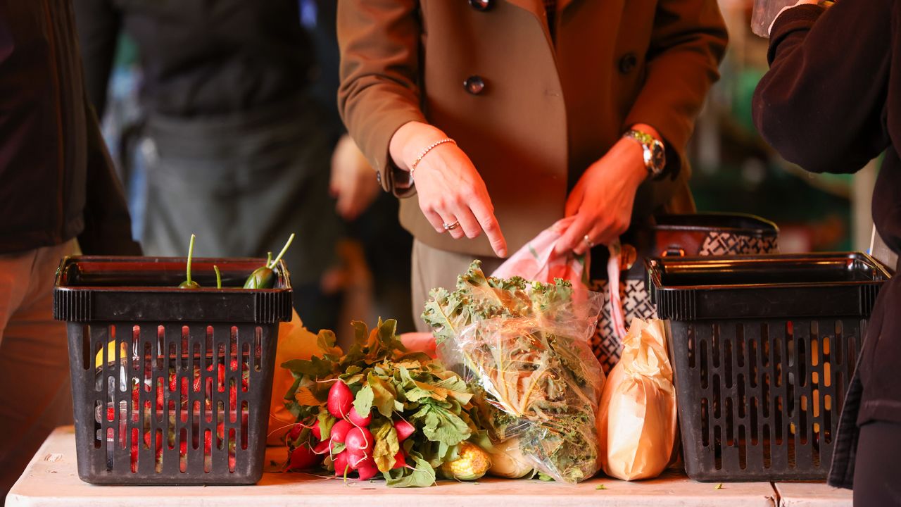 A customer shops for fresh fruit and vegetables at a market in Oxford, United Kingdom, on Wednesday, July 19, 2023. 