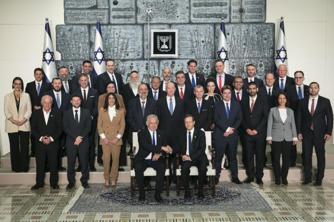 Netanyahu and Israeli President Isaac Herzog, front row, pose with members of the new Israeli government in December 2022. Netanyahu was <a href="index.php?page=&url=https%3A%2F%2Fedition.cnn.com%2F2022%2F12%2F29%2Fmiddleeast%2Fisrael-benjamin-netanyahu-swearing-in-intl%2Findex.html" target="_blank">sworn in for his sixth term as prime minister</a>, 18 months after he was ousted from power.