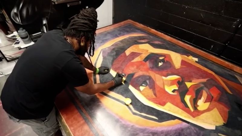 Video: Tattoo artist uses surprising medium to set world record | CNN