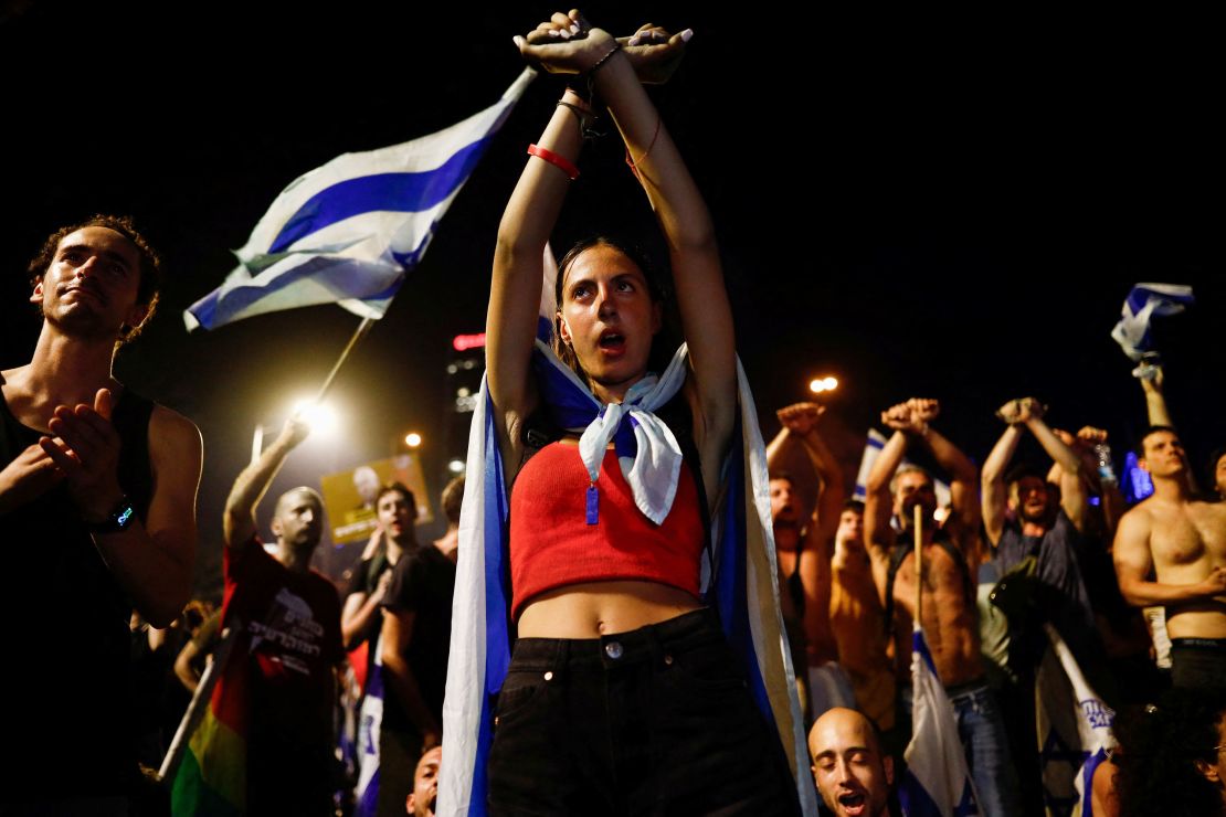 A person gestures as protesters block Ayalon Highway during a demonstration following a parliament vote on a contested bill that limits Supreme Court powers to void some government decisions, in Tel Aviv, Israel July 25, 2023. REUTERS/Corinna Kern