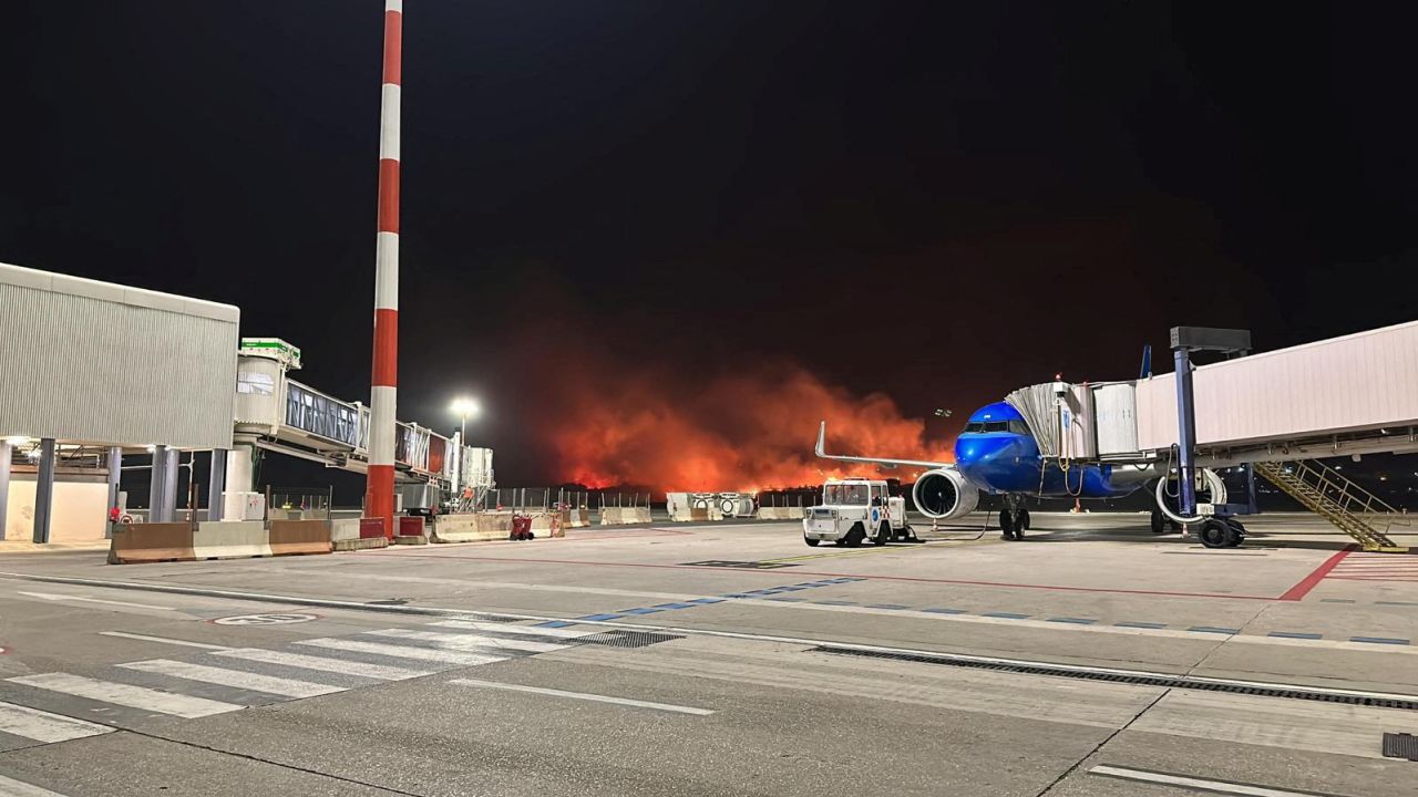 A wildfire burns near the Sicilian airport Falcone-Borsellino in Palermo, Italy, July 25, 2023. .