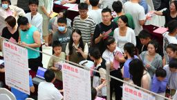 Job seekers look for job opportunities at a job fair on July 15, 2023 in Tengzhou, Zaozhuang City, Shandong Province of China. 