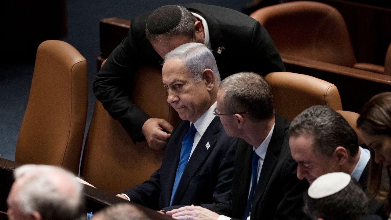 Israel's Prime Minister Benjamin Netanyahu, center, is surrounded by lawmakers at a session of the Knesset, Israel's parliament, in Israel on Monday.