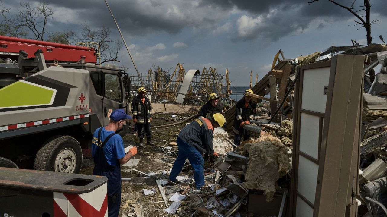 Emergency service personnel work at the site of a destroyed building near the Odesa Port after a Russian attack in Odesa, Ukraine, Thursday, July 20, 2023. Russia pounded Ukraine's southern cities, including the port city of Odesa, with drones and missiles for a third consecutive night in a wave of strikes that has destroyed some of the country's critical grain export infrastructure. (AP Photo/Libkos)
