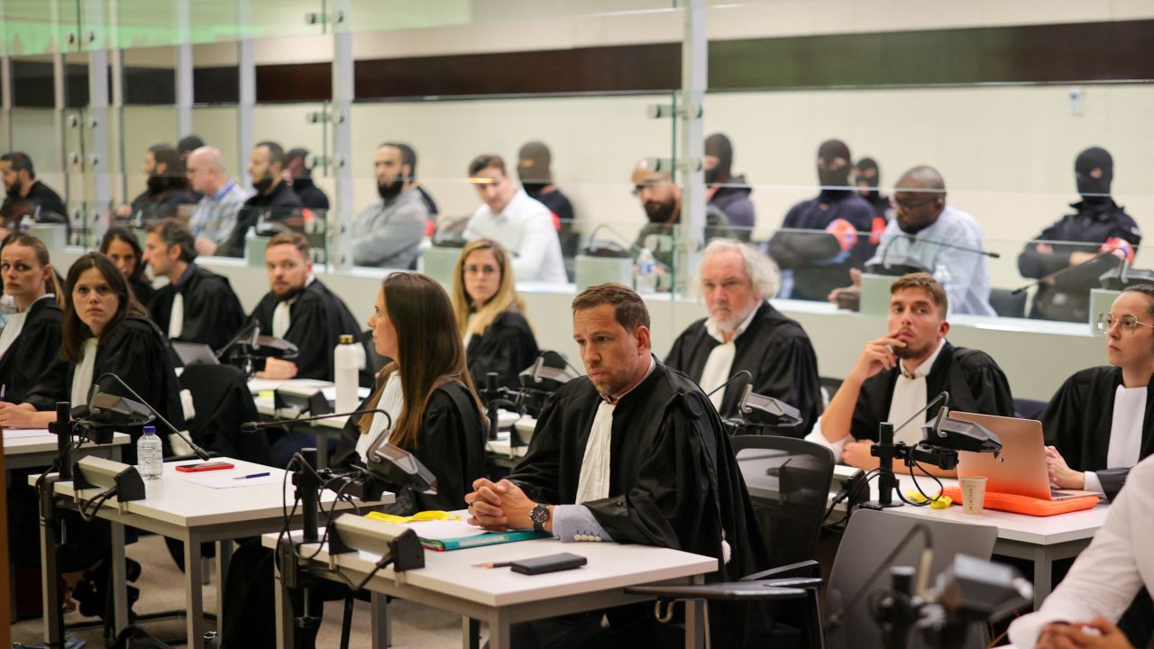 Defendants sit in a specially designed glass box in the courtroom during the start of the Brussels terrorist attack trial verdict being announced in the Palace of Justice building, Brussels, Belgium 25 July 2023. 1