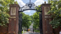 People walk through the gate on Harvard Yard at the Harvard University campus on June 29, 2023 in Cambridge, Massachusetts.