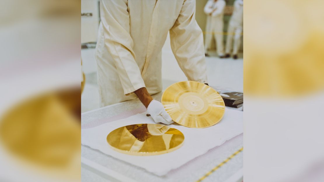 A gold record ready to be attached to a Voyager space probe, USA, circa 1977. Voyager 1 and its identical sister craft Voyager 2 were launched in 1977 to study the outer Solar System and eventually interstellar space. The record, entitled 'The Sounds Of Earth' contains a selection of recordings of  life and culture on Earth. The cover contains instructions for any extraterrestrial being wishing to play the record. (Photo by NASA/Hulton Archive/Getty Images)