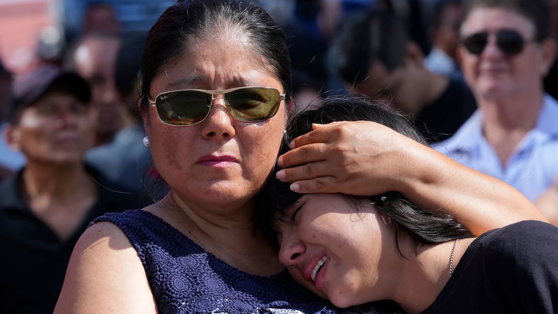 Mourners cry during the funeral Agustin Intriago's funeral in Manta, Ecuador on July 24, 2023.