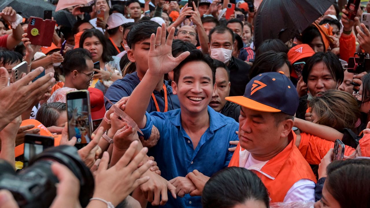 TOPSHOT - Move Forward Party leader and prime ministerial candidate Pita Limjaroenrat is mobbed by supporters during a rally ahead of the July 13 parliamentary vote to elect Thailand's next prime minister, in front of Central World in Bangkok on July 9, 2023. (Photo by Tananchai KEAWSOWATTANA / THAI NEWS PIX / AFP) (Photo by TANANCHAI KEAWSOWATTANA/THAI NEWS PIX/AFP via Getty Images)