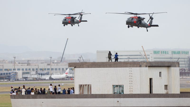 NextImg:Taiwan's main airport becomes battleground for simulated Chinese invasion | CNN