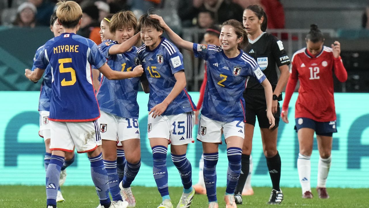 Fujino (middle) is congratulated by her teammates after scoring Japan's second goal against Costa Rica.