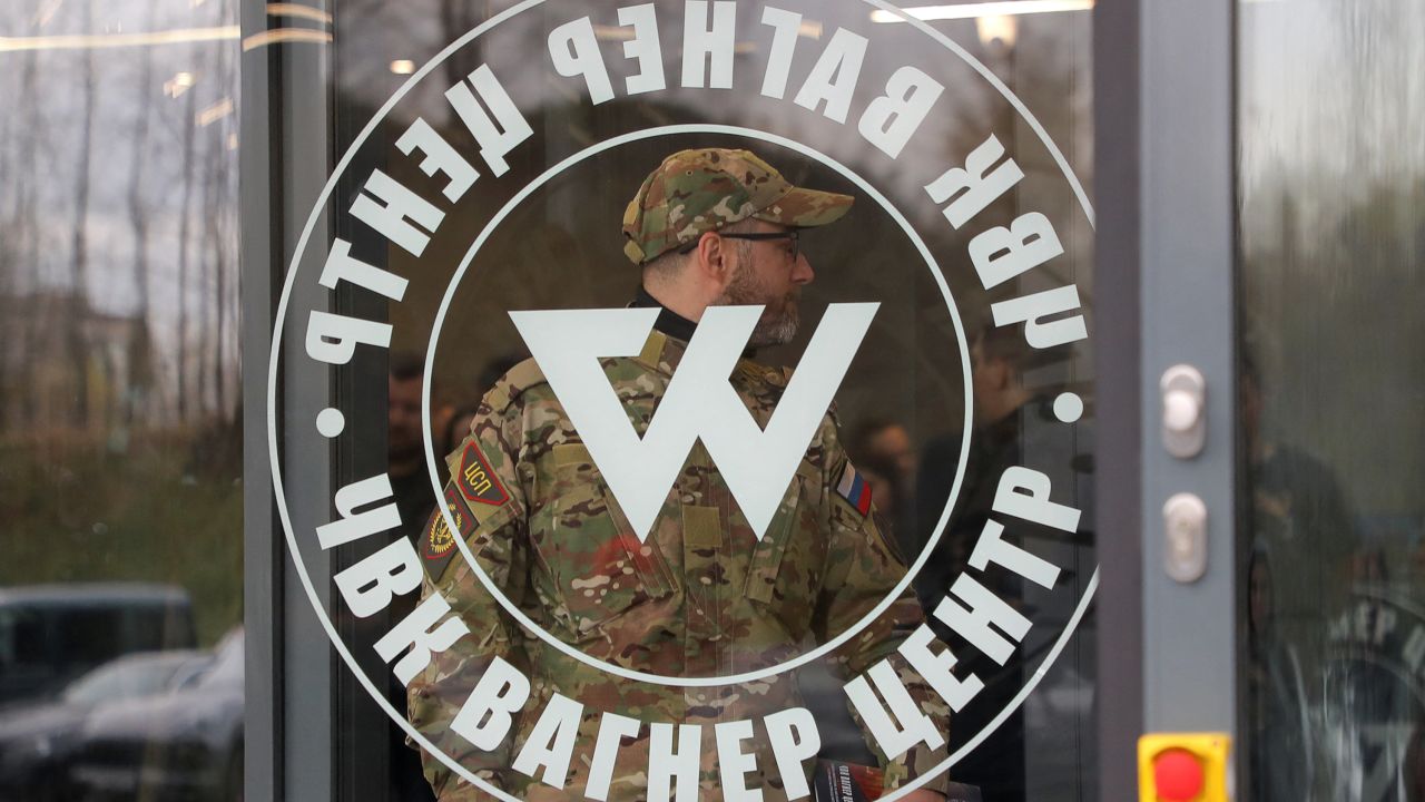 A man wearing a camouflage uniform walks out of PMC Wagner Centre, which is a project implemented by the businessman and founder of the Wagner private military group Yevgeny Prigozhin, during the official opening of the office block in Saint Petersburg, Russia, November 4, 2022. REUTERS/Igor Russak