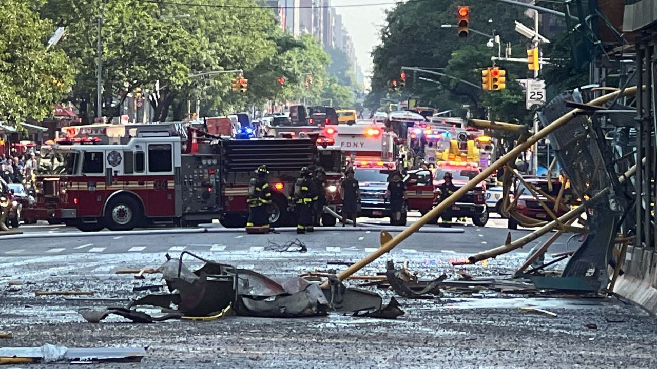 Debris from the crane collapse litters 10th Avenue.