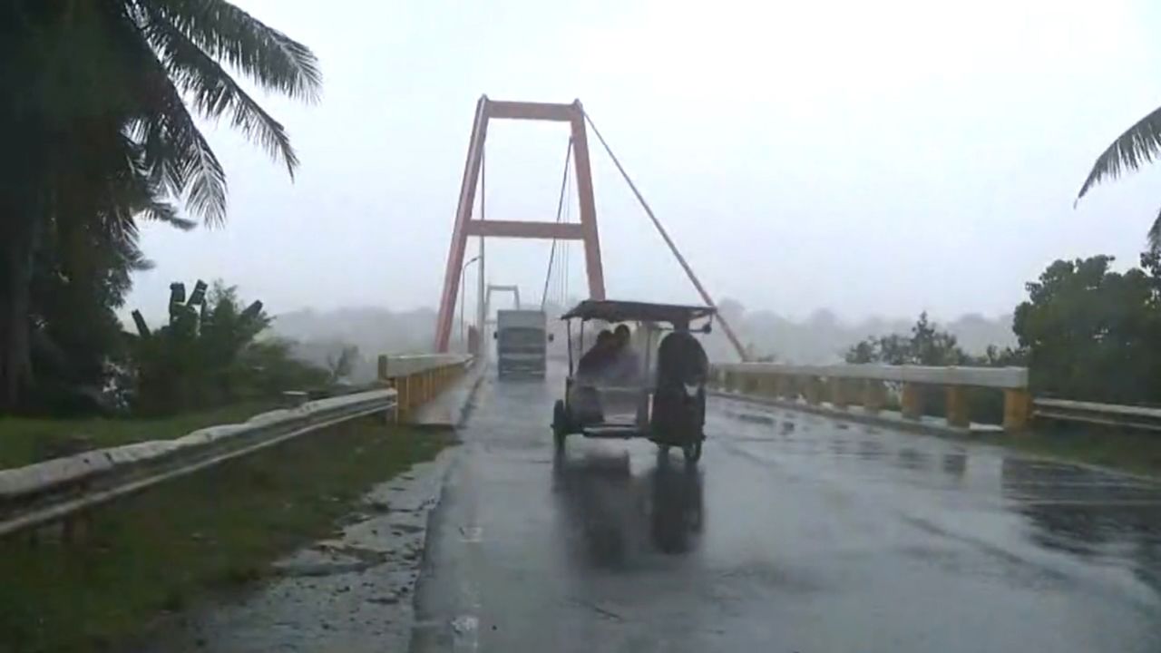 Vehicles battle harsh gusts along a bridge in Cagayan province, Philippines on July 25, 2023.
