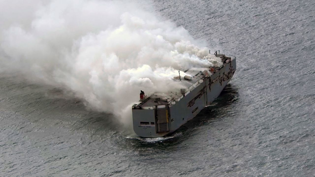 Smoke is seen from a cargo ship in the North Sea, about 27 kilometers (17 miles) north of the Dutch island of Ameland.