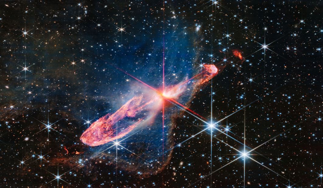 The James Webb Space Telescope captured a high-resolution image of a pair of actively forming stars called Herbig-Haro 46/47. The stellar duo, only a few thousand years old, is located at the center of the red diffraction spikes. 