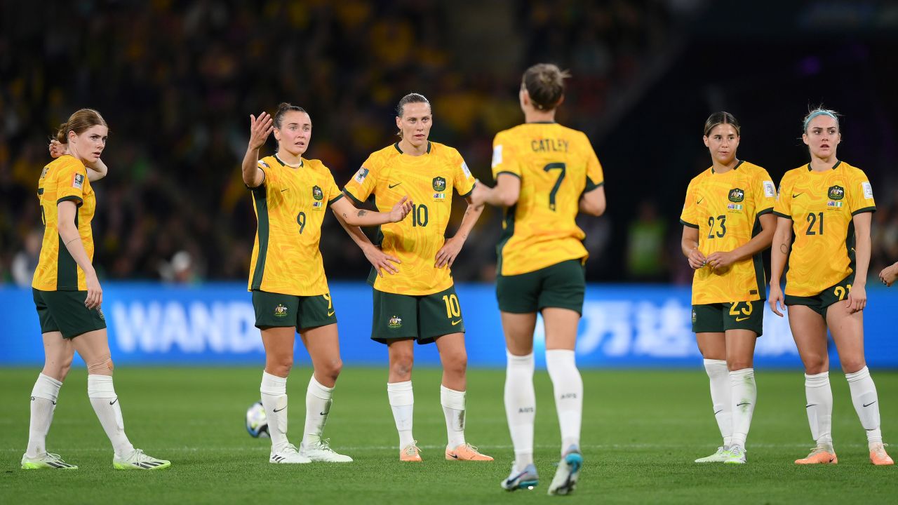 Australia players talk in the huddle follow Nigeria's second goal.