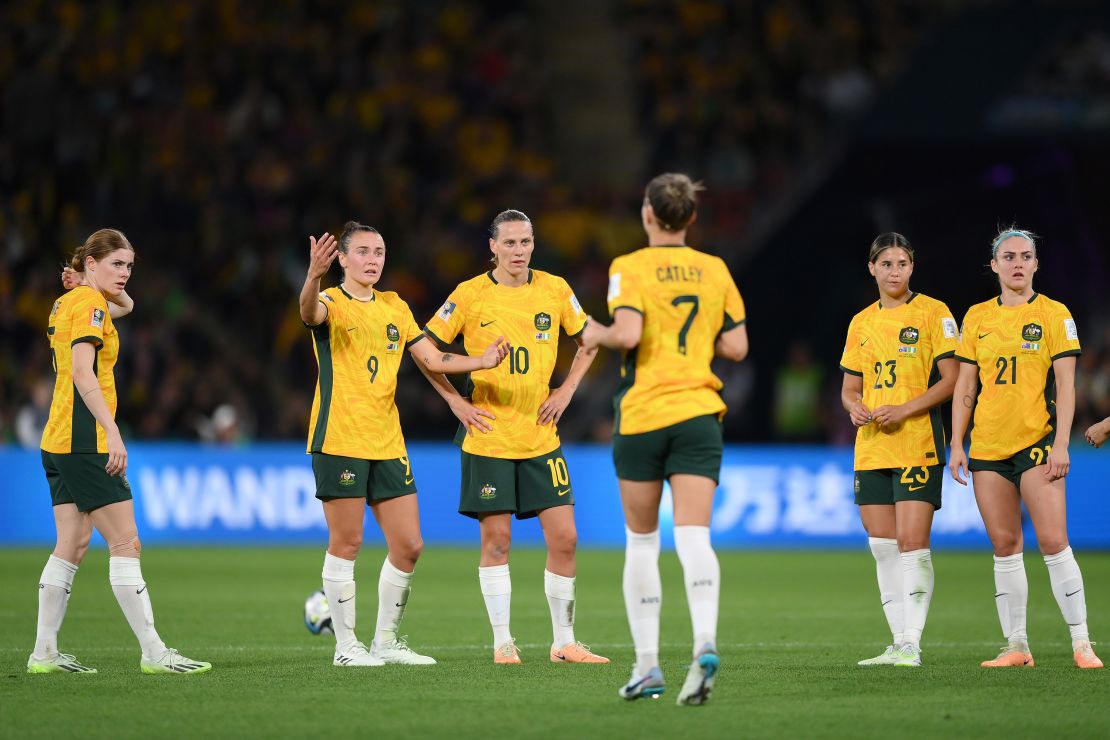 Australia players talk in the huddle follow Nigeria's second goal.