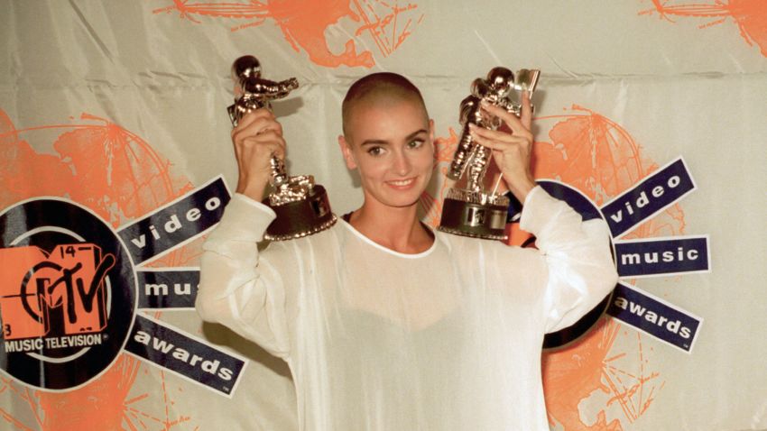 Irish singer-songwriter Sinead O'Connor displays two of her three awards she won at the 7th annual MTV Video Music Awards in Universal City, Ca., Thursday evening, Sept. 6, 1990.  O'Connor won for her single "Nothing Compares 2 U" in the video of the year, female video and post modern video categories.  (AP Photo/Kevork Djansezian)