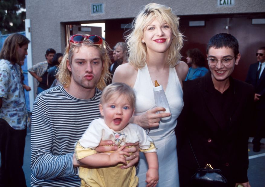 O'Connor is pictured with rockers Kurt Cobain and Courtney Love, along with their daughter, Frances, at the MTV Video Music Awards in September 1993.