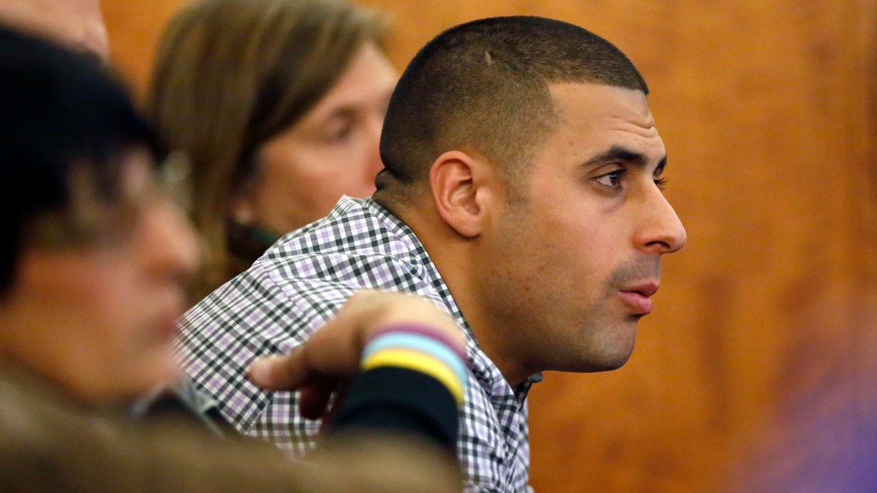 FILE - Dennis Hernandez, brother of former New England Patriots NFL football player Aaron Hernandez, watches during his brother's murder trial on Jan. 29, 2015, in Fall River, Mass. Former UConn football player Dennis Hernandez is behind bars after a witness told police she believed he was planning a school shooting.   The 37-year-old, who went by DJ while playing for the Huskies as a quarterback and receiver in the mid-2000s, is due in court on Aug. 1 on charges including threatening. (AP Photo/Steven Senne, Pool, File)