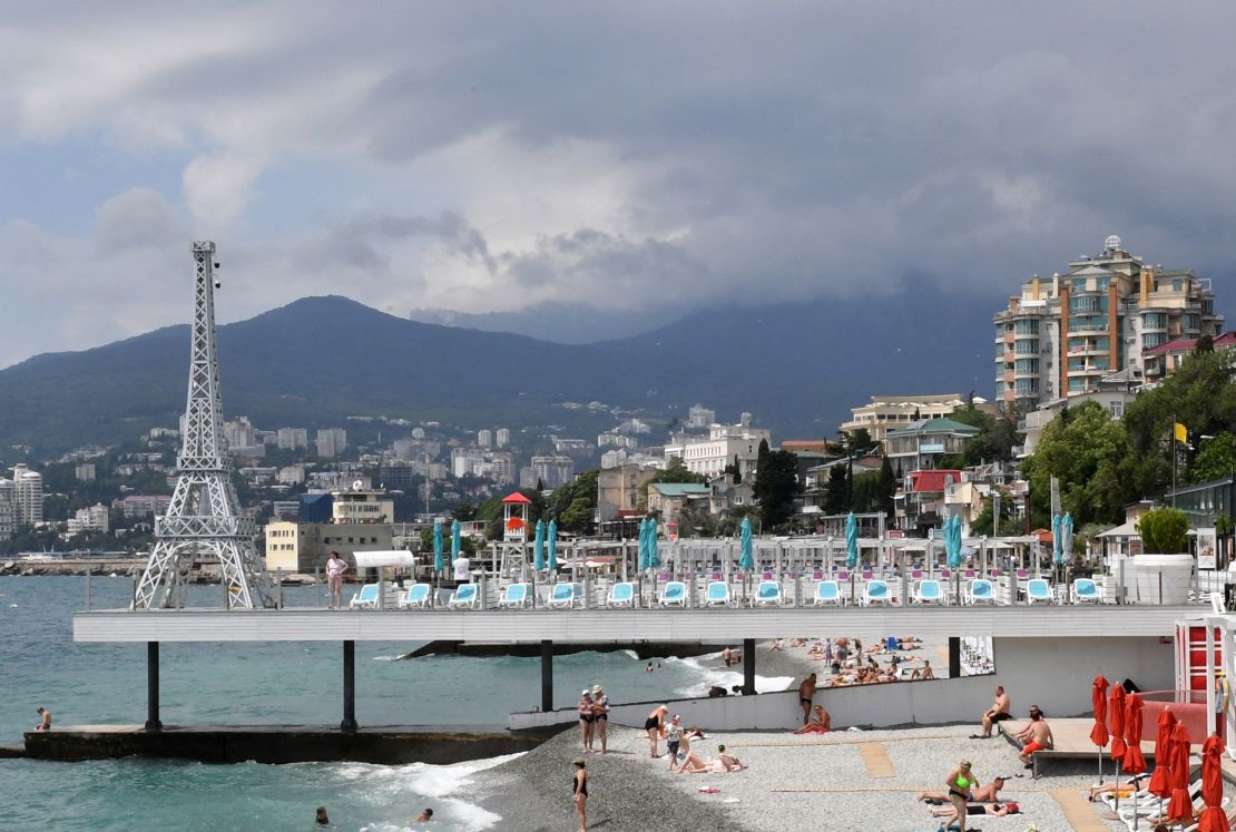 People relax on a beach on the Black Sea in Yalta, Crimea, on June 19, 2023.