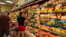 People shop for fresh vegetables at a Trader Joe's supermarket in South Burlington, Vermont, on July 6.