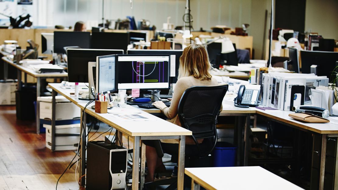 Woman working office space STOCK RESTRICTED