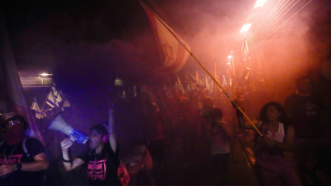 Israelis protest against plans to overhaul the judicial system in Tel Aviv, on July 27, 2023.