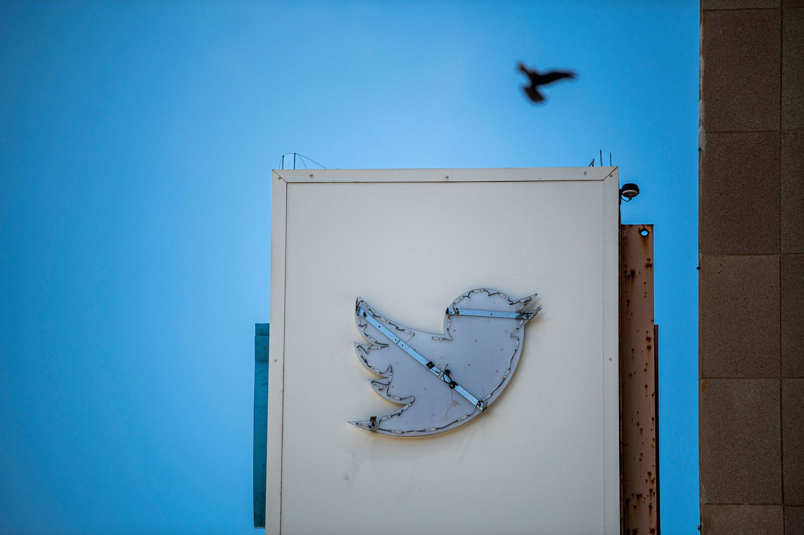 A Twitter sign is partially removed from the company's headquarters in San Francisco on Wednesday, July 26. Elon Musk's move to rebrand Twitter and <a href="https://www.cnn.com/2023/07/25/tech/twitter-x-elon-musk-rebrand-strategy/index.html" target="_blank">replace its iconic bird logo with an X</a> is just the latest step in his effort to make over the social media platform in his image.