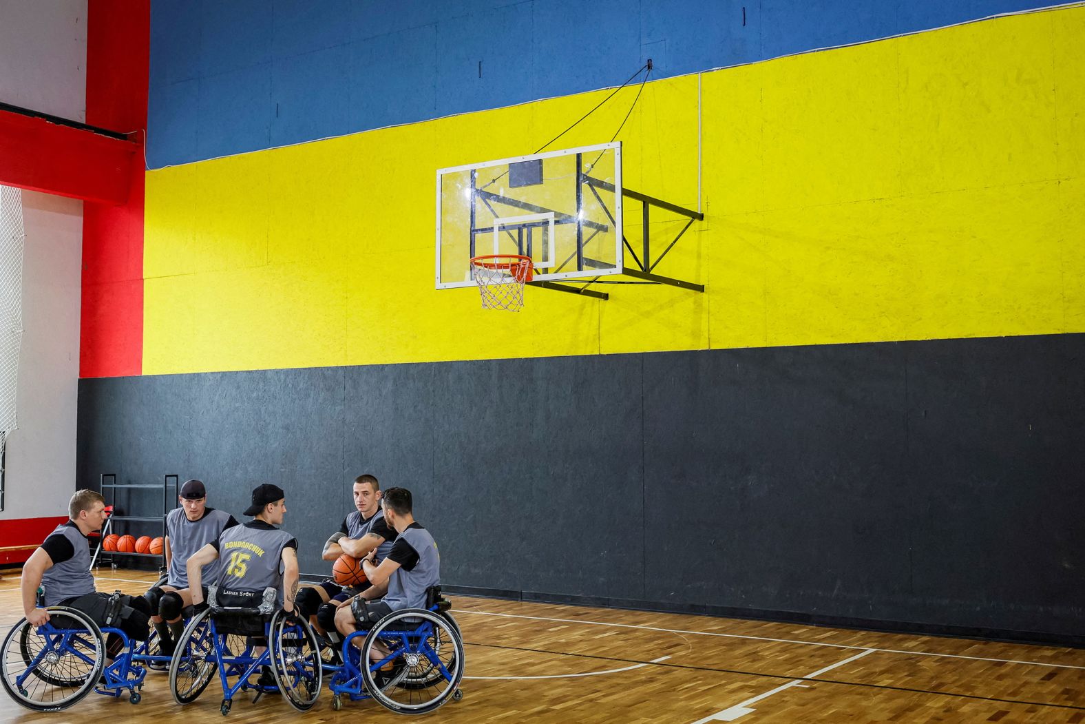 Former Ukrainian servicemen practice wheelchair basketball in Kyiv, Ukraine, on Thursday, July 27. They are planning to compete at the upcoming Invictus Games in Germany.