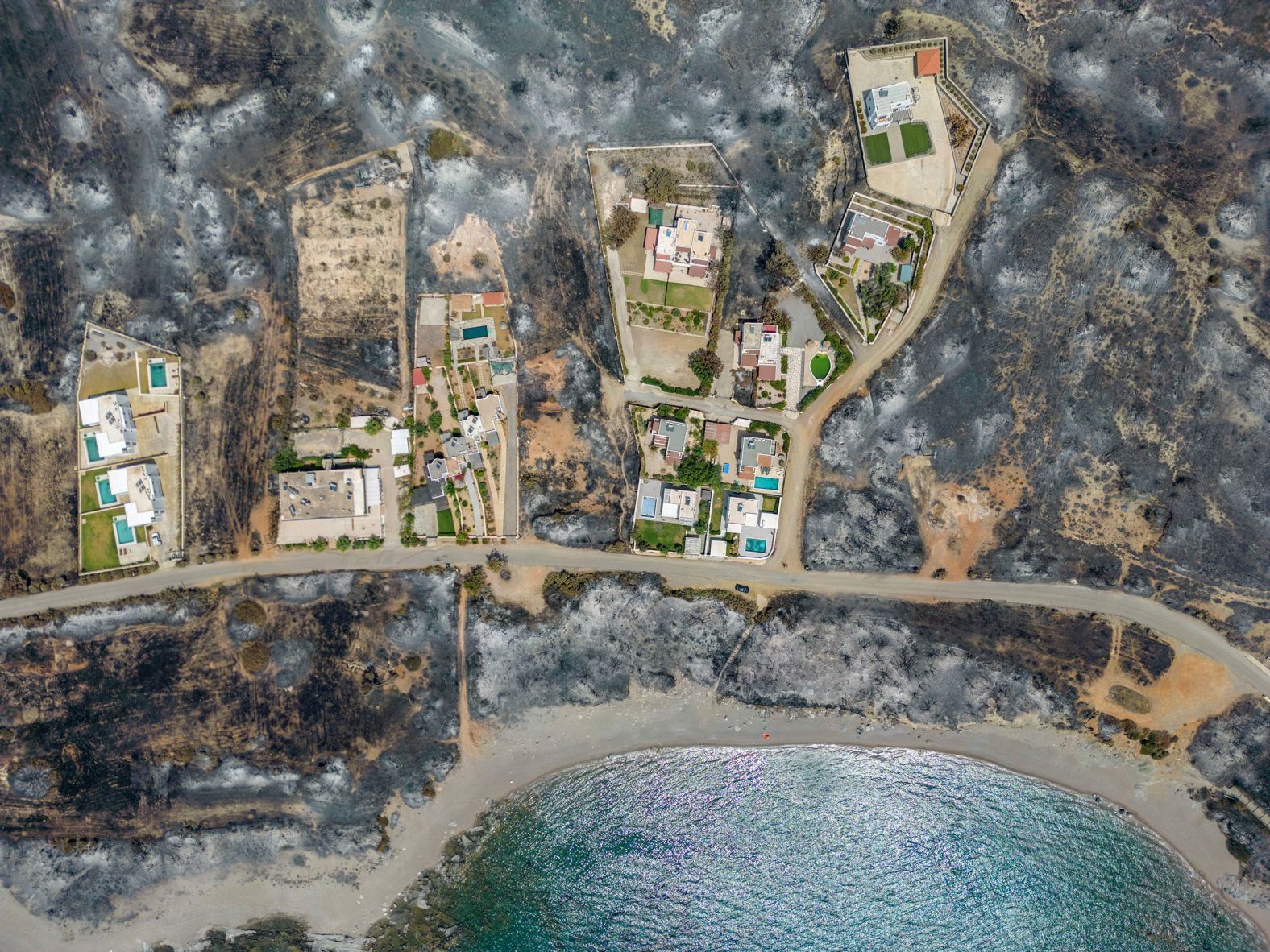 This aerial photo. taken on Thursday, July 27, shows land that was burned by a wildfire on the Greek island of Rhodes. <a href="https://www.cnn.com/2023/07/22/europe/greece-record-breaking-heat-wave-climate-intl/index.html" target="_blank">The fire forced thousands of tourists to flee their hotels</a> in what Greek officials said was the largest evacuation effort in the country's history.
