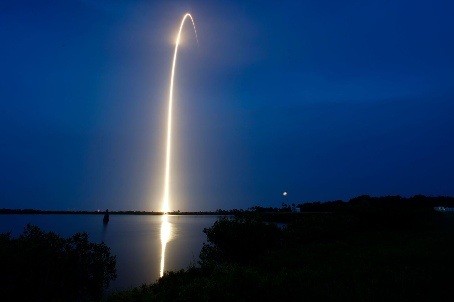 This long-exposure photo, taken on Sunday, July 23, shows a SpaceX Falcon 9 rocket lifting off from Cape Canaveral, Florida, with a payload of Starlink internet satellites.