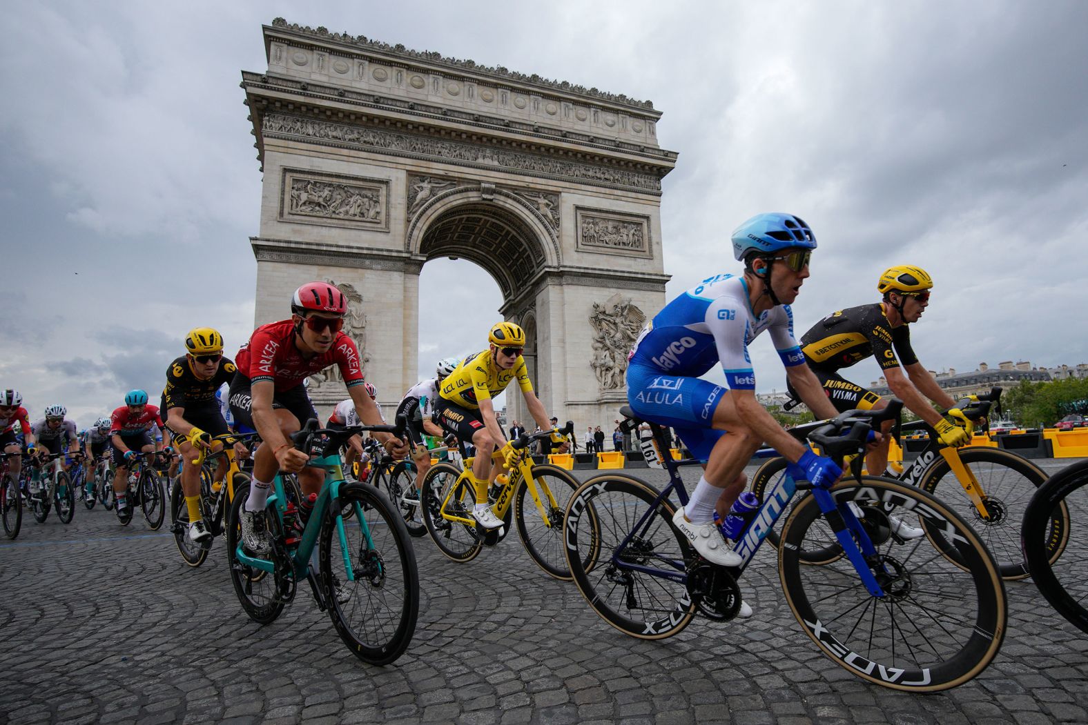 Cyclists pass the Arc de Triomphe in Paris during the final stage of the Tour de France on Sunday, July 23. <a href="https://www.cnn.com/2023/07/23/sport/jonas-vingegaard-tour-de-france-victory-spt-intl/index.html" target="_blank">The race was won for the second straight year</a> by Denmark's Jonas Vingegaard, who can be seen here in the yellow jersey.