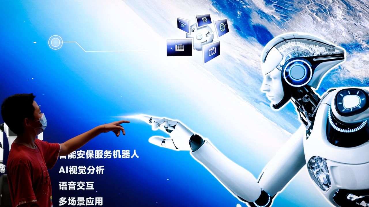 BEIJING, CHINA - AUGUST 18: A boy points to the AI robot Poster during the 2022 World Robot Conference at Beijing Etrong International Exhibition on August 18, 2022 in Beijing, China. The 2022 World Robot Conference kicked off on Thursday in Beijing. (Photo by Lintao Zhang/Getty Images)