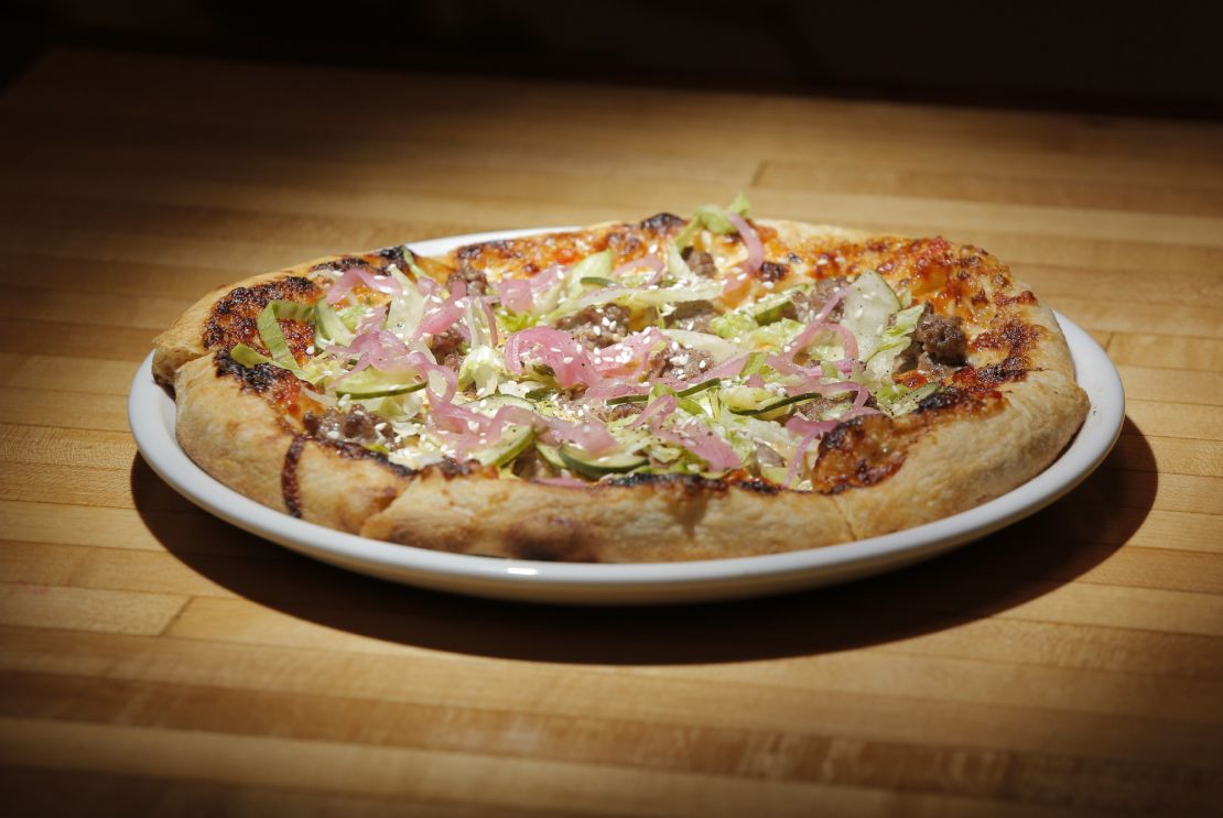 WESTBROOK, ME - SEPTEMBER 6: The Mac pizza, made with hamburger, 1000 island dressing, pickles, american cheese, red onion, romaine lettuce and sesame crust at 33 in Westbrook, photographed on Wednesday, September 6, 2017 for a review of bowling alleys that serve food. (Staff Photo by Gregory Rec/Staff Photographer)