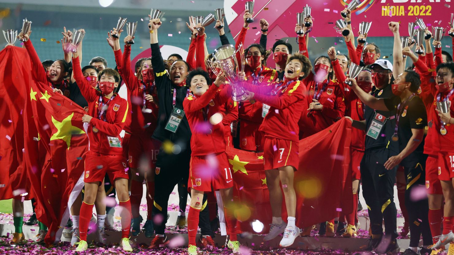The Chinese women's team celebrate coming from two goals behind to beat South Korea 3-2 in the final of the AFC Women's Asian Cup in Mumbai, India, in February 2022.